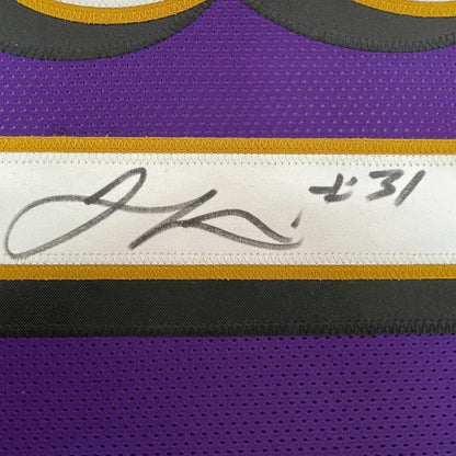 Autographed purple Jamal Lewis Ravens jersey in professionally framed display