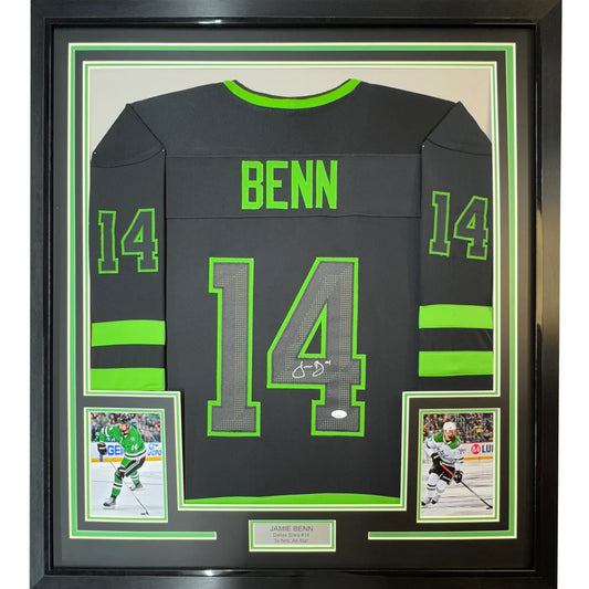 Back view of a framed autographed black hockey jersey with neon green accents featuring name benn and number 14 signed by Jamie Benn