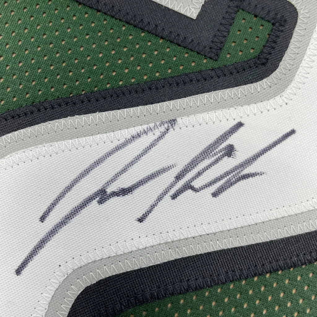 Framed autographed green and white mesh philadelphia football jersey with black trim signed by jason kelce