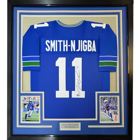 Framed autographed blue seattle seahawks jersey with white number 11 smith-njigba and green sleeve stripes