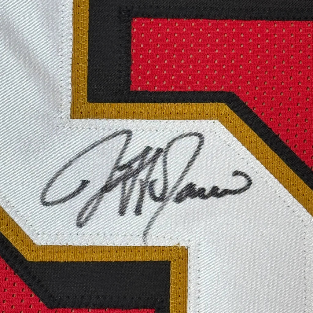 Black ink signature on a white mesh san francisco red football jersey with red and gold trim framed autographed jersey