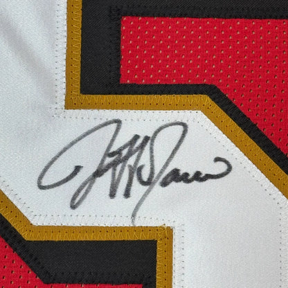 Black ink signature on a white mesh san francisco red football jersey with red and gold trim framed autographed jersey