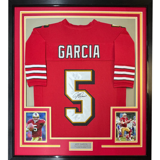Framed autographed red San Francisco 49ers football jersey with white and gold number 5 and name Garcia signed by Jeff Garcia
