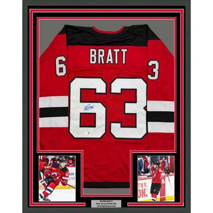 Framed autographed Jesper Bratt red New Jersey Devils jersey with number 63