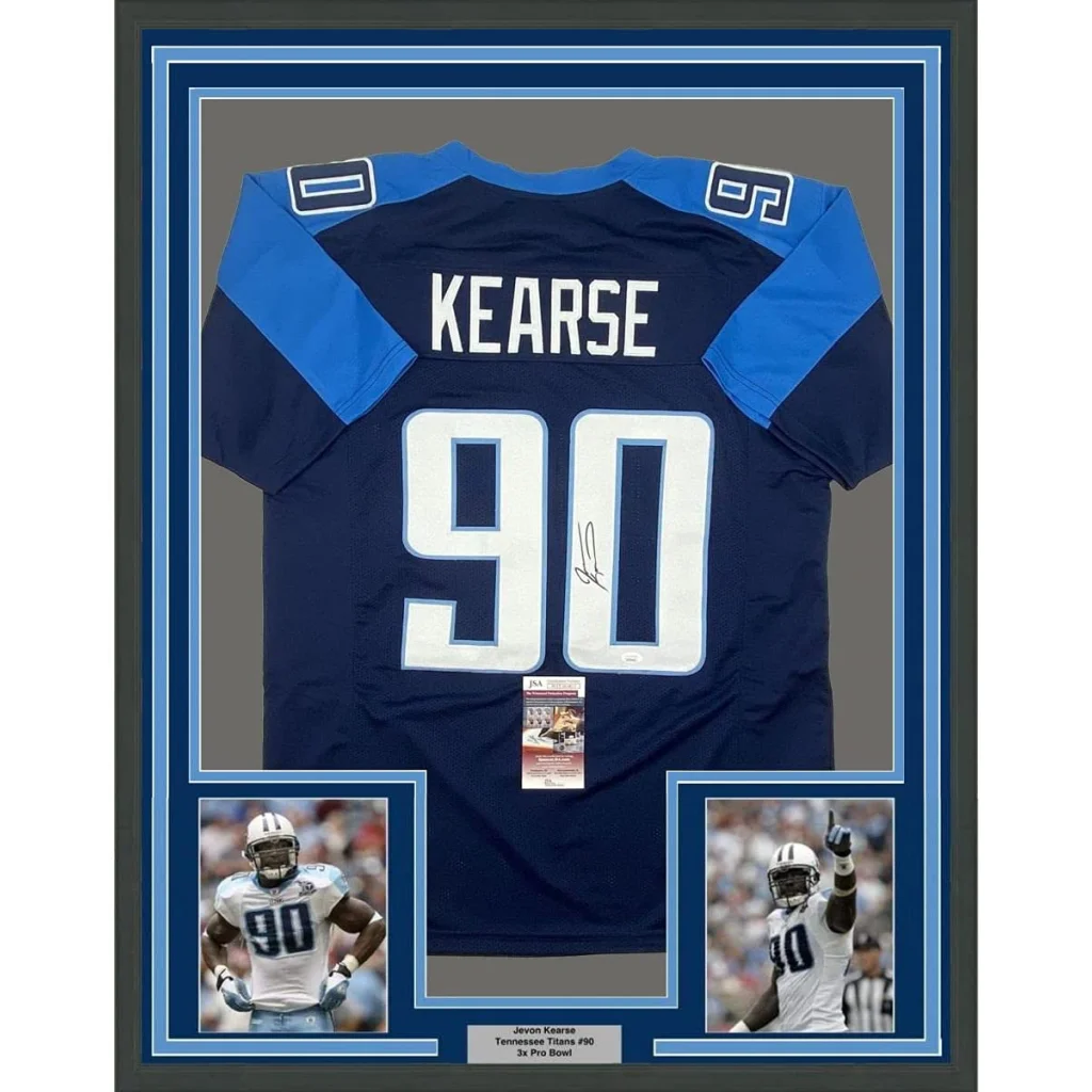Image of the back side of a framed autographed navy and light blue tennessee titans jersey with white number 90 and name kearse signed by jevon kearse
