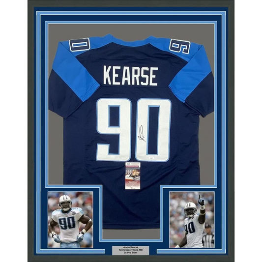 Image of the back side of a framed autographed navy and light blue tennessee titans jersey with white number 90 and name kearse signed by jevon kearse