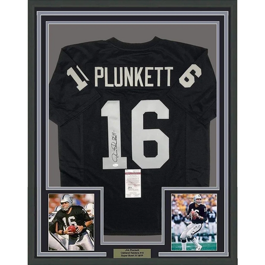 Framed autographed black oakland raiders football jersey with white number 16 and name plunkett displayed from back