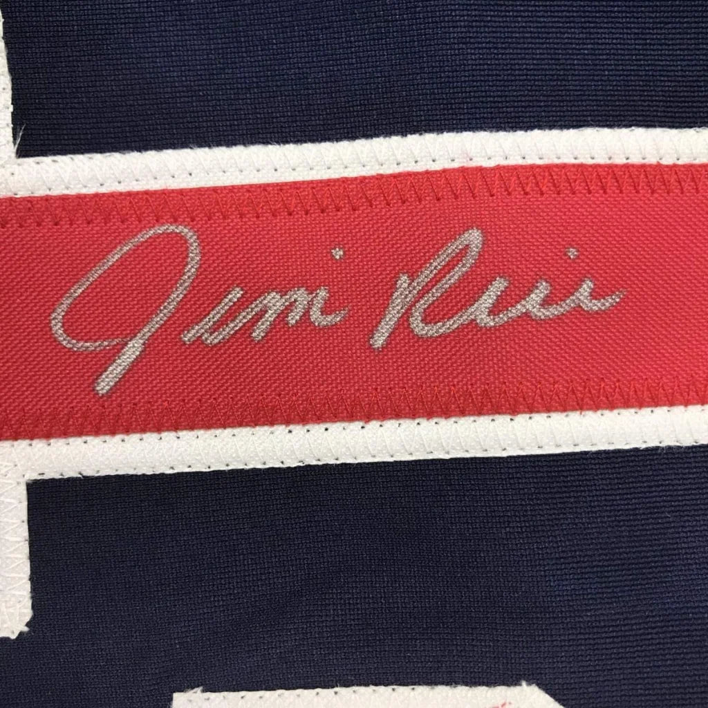 Red fabric band with embroidered signature on dark blue textile of Legendary Framed Baseball Jersey