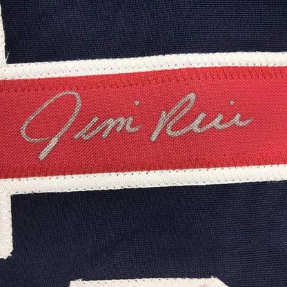 Red fabric band with embroidered signature on dark blue textile of Legendary Framed Baseball Jersey