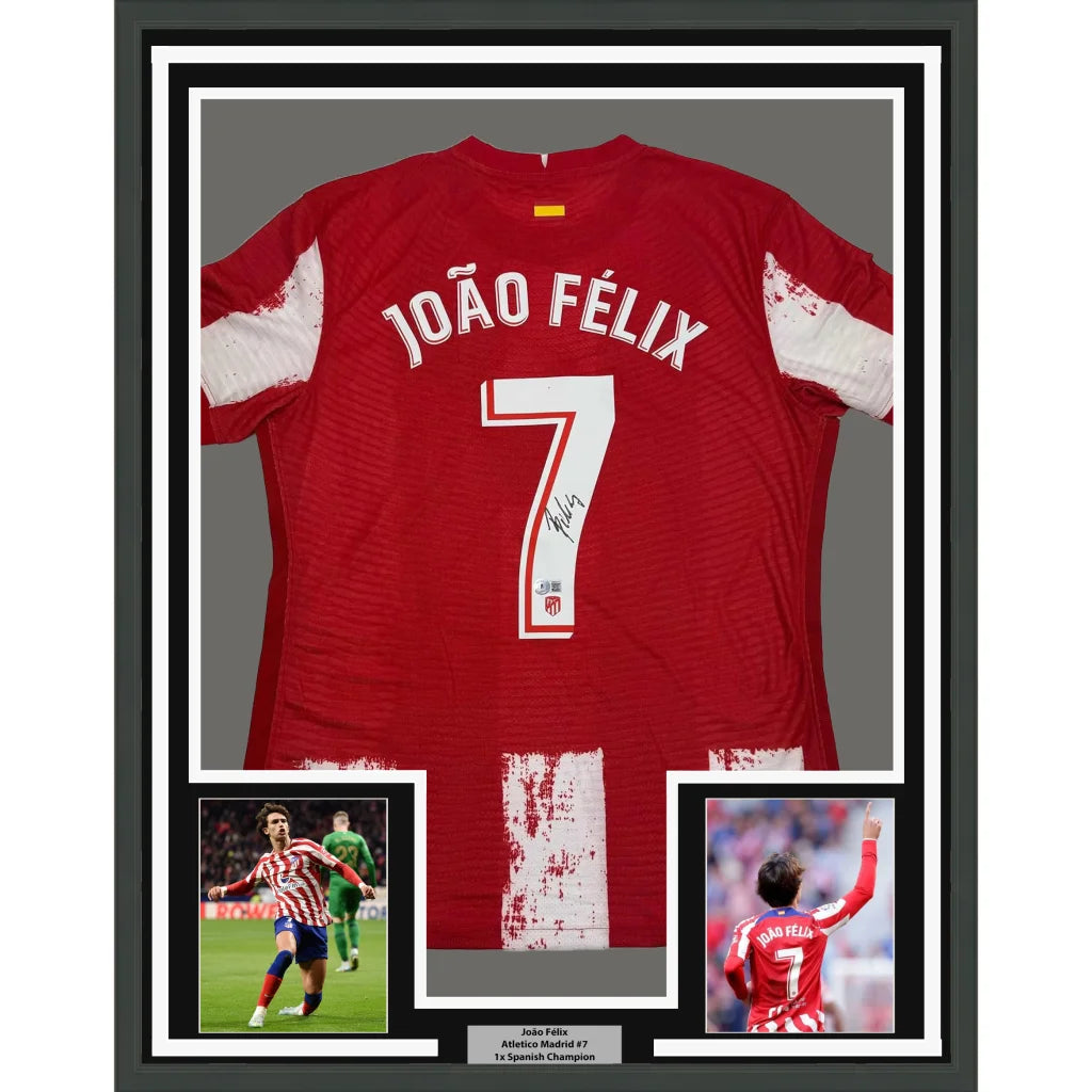 Framed autographed atletico madrid red soccer jersey with white sleeves and number 7 signed by joao felix