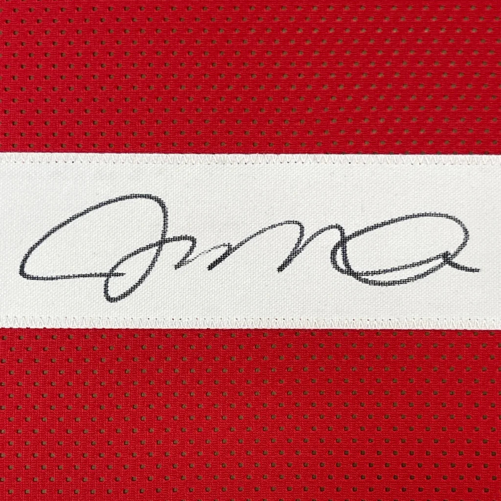 Framed autographed Joe Montana San Francisco 49ers red jersey with black signature