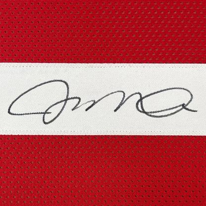Framed autographed Joe Montana San Francisco 49ers red jersey with black signature