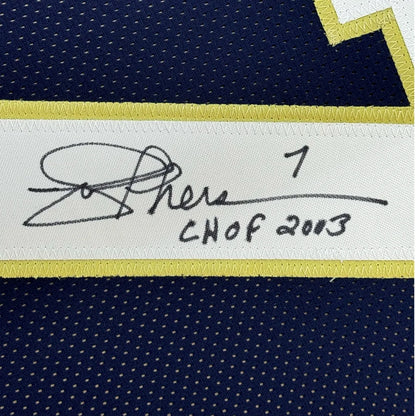 Autographed dark blue custom jersey with yellow trim from professional sports league