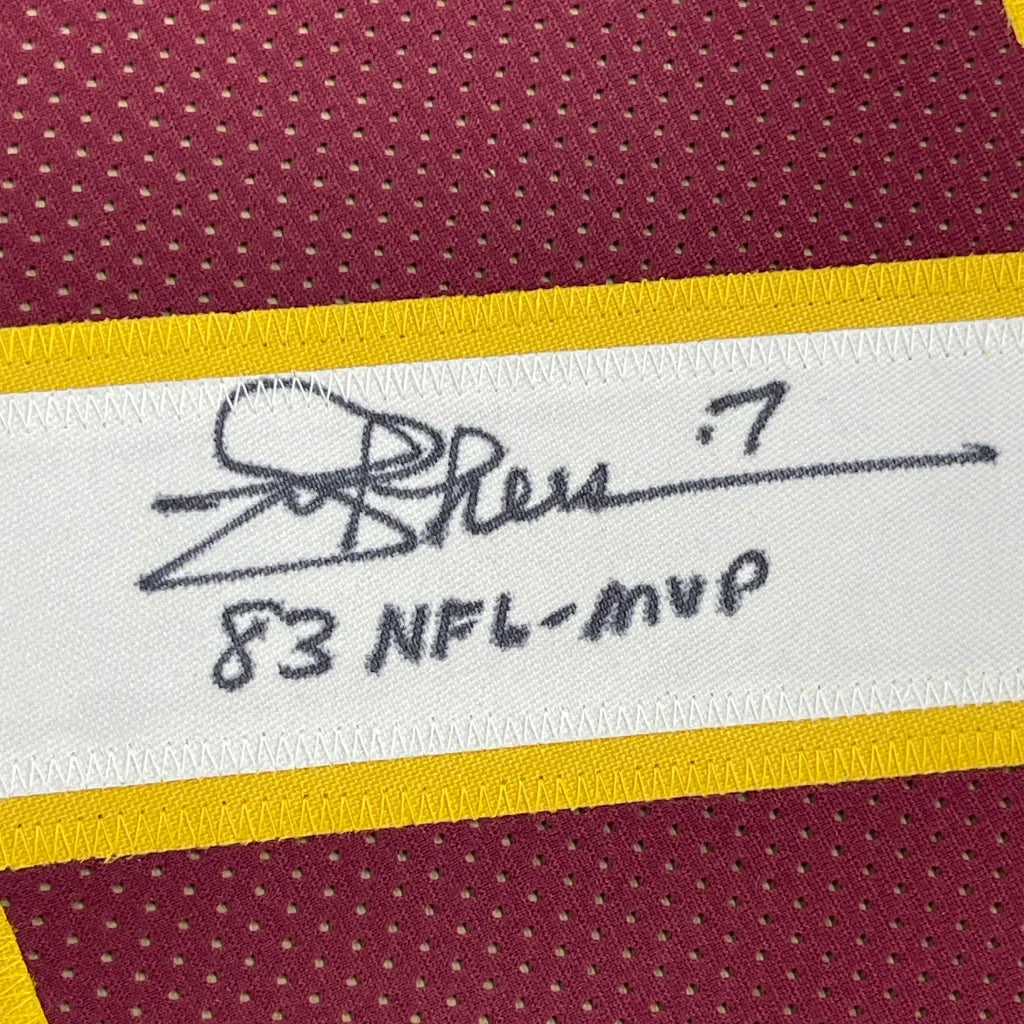 Autographed Burgundy and Gold Theismann 7 Jersey with Framed Photos on display