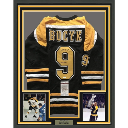 Framed autographed black Boston Bruins jersey with Bucyk 9, JSA COA