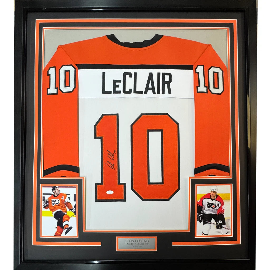 Framed John LeClair Flyers jersey with autographs and player photos for display