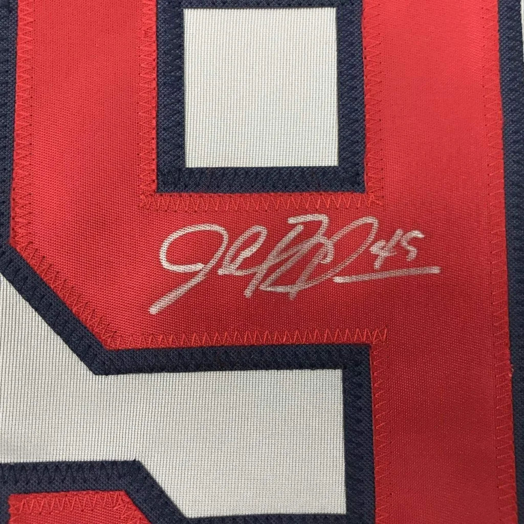 Red and white Atlanta Braves jersey with black outline and silver autograph in frame