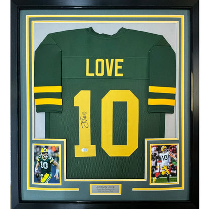 Framed Green Bay Packers Jordan Love autographed jersey with player photos on display