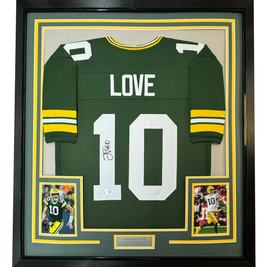 Autographed Green Bay Packers Jordan Love jersey in museum-style frame for display