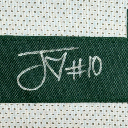 Dark green woven label with white embroidered script jn#10 on a framed autographed jordan love green bay jersey