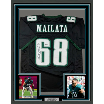 Framed autographed black philadelphia eagles football jersey with green and white accents featuring name mailata number 68 signed by jordan mailata back side