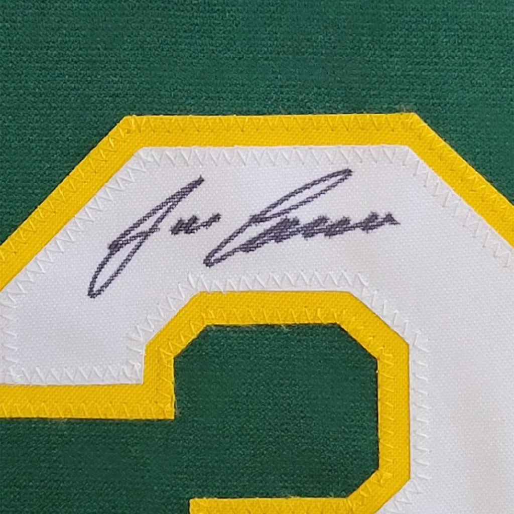 Framed autographed Jose Canseco Oakland green jersey back with green yellow embroidered 2 and white signature patch