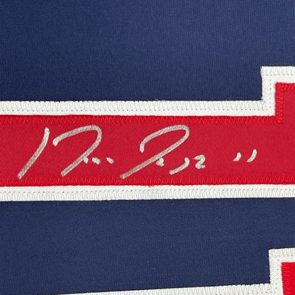Red and white embroidered Jose Ramirez signature stripe on navy blue Cleveland Guardians jersey back