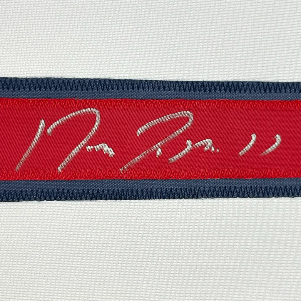 Red and navy striped band with white Jose Ramirez embroidered signature on framed Cleveland jersey