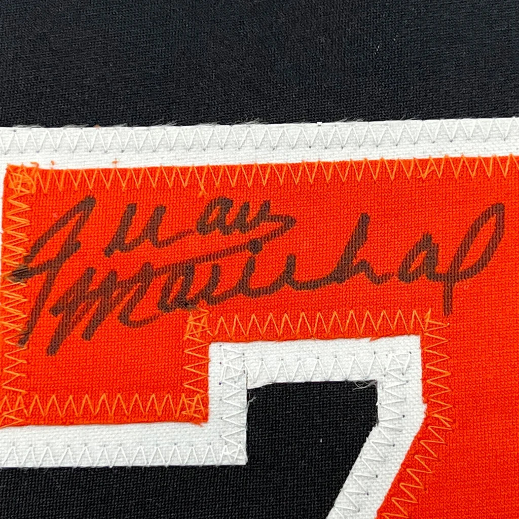 Autographed orange Juan Marichal Giants jersey with number 7 ready to display
