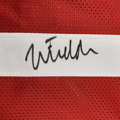 Framed autographed ohio state red mesh football jersey with white stripe and black signature by justin fields
