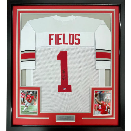 Framed autographed ohio state white and red football jersey with fields name and number 1 signed by justin fields