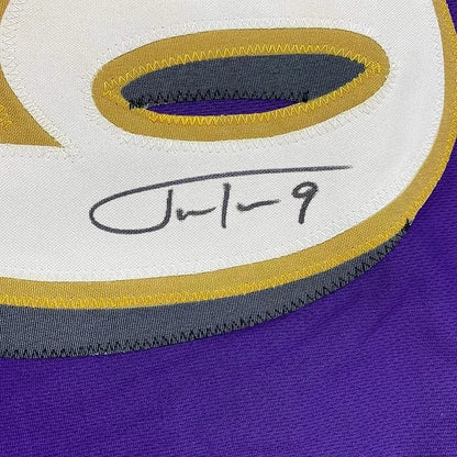 Framed autographed Justin Tucker Baltimore purple jersey with number 8