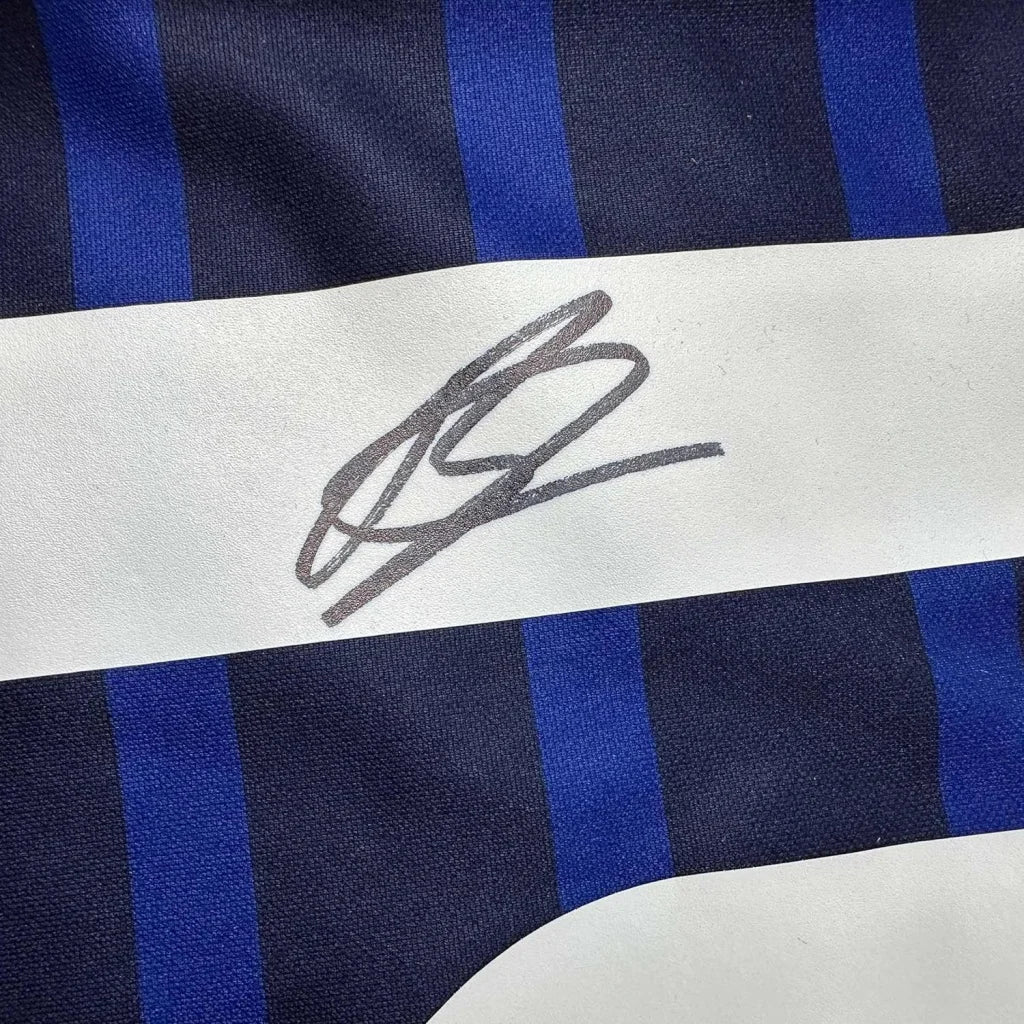 Dark blue and white striped fabric with gray autograph on Karim Benzema France jersey