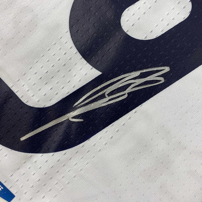 White Real Madrid jersey with dark blue number and silver Karim Benzema autograph