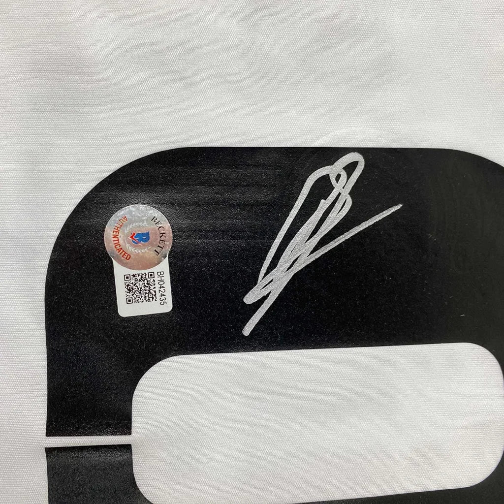 Autographed black and white Karim Benzema Real Madrid jersey with authentication sticker