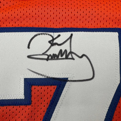 Black ink signature on white fabric patch of orange and blue denver football jersey framed autographed karl mecklenburg