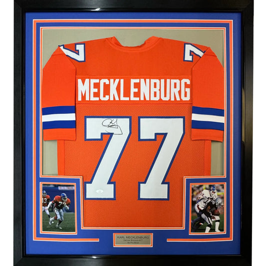 Orange Denver Broncos framed autographed football jersey with white and blue accents featuring Mecklenburg 77 signed by Karl Mecklenburg