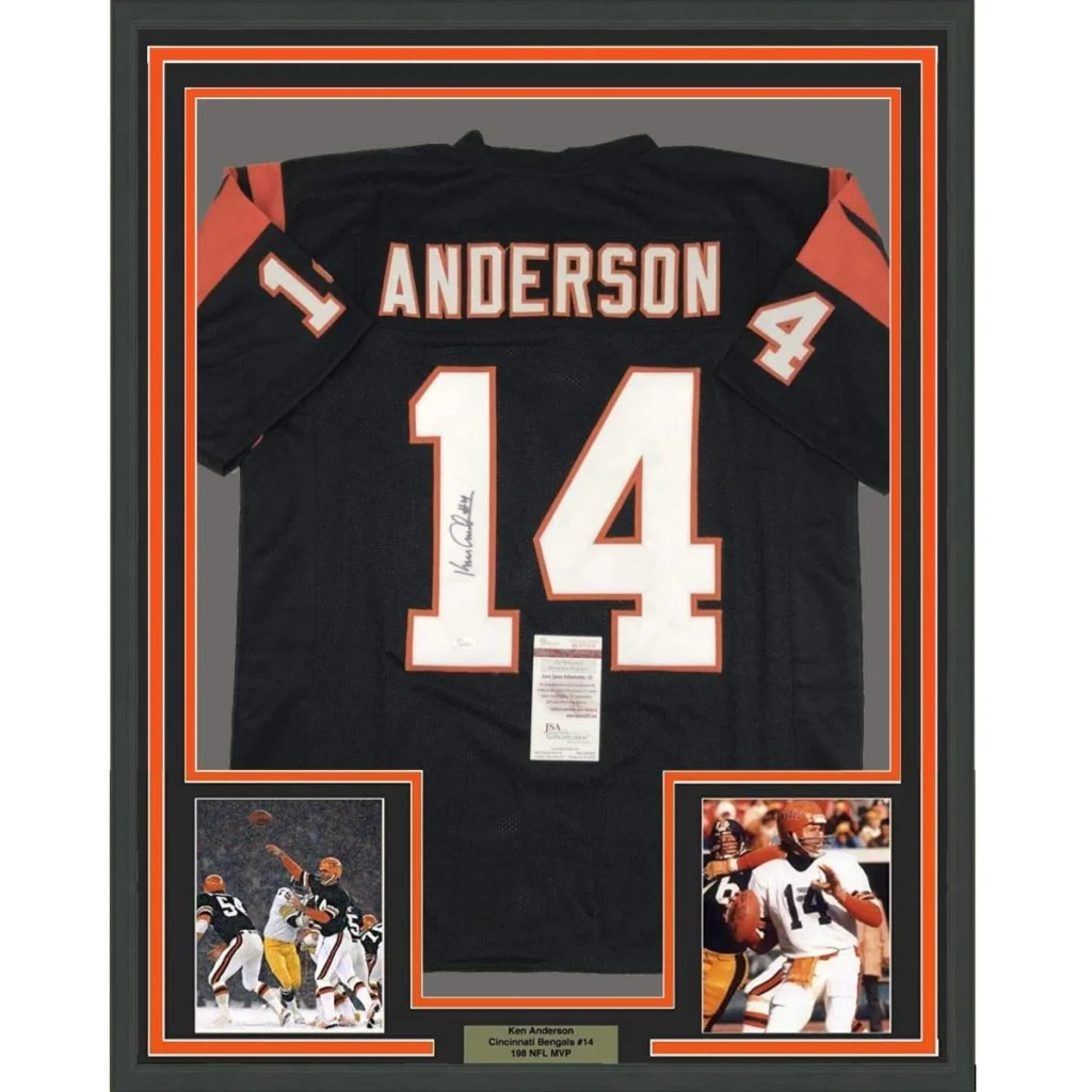 Autographed Ken Anderson Bengals jersey with display photos in a frame for fans