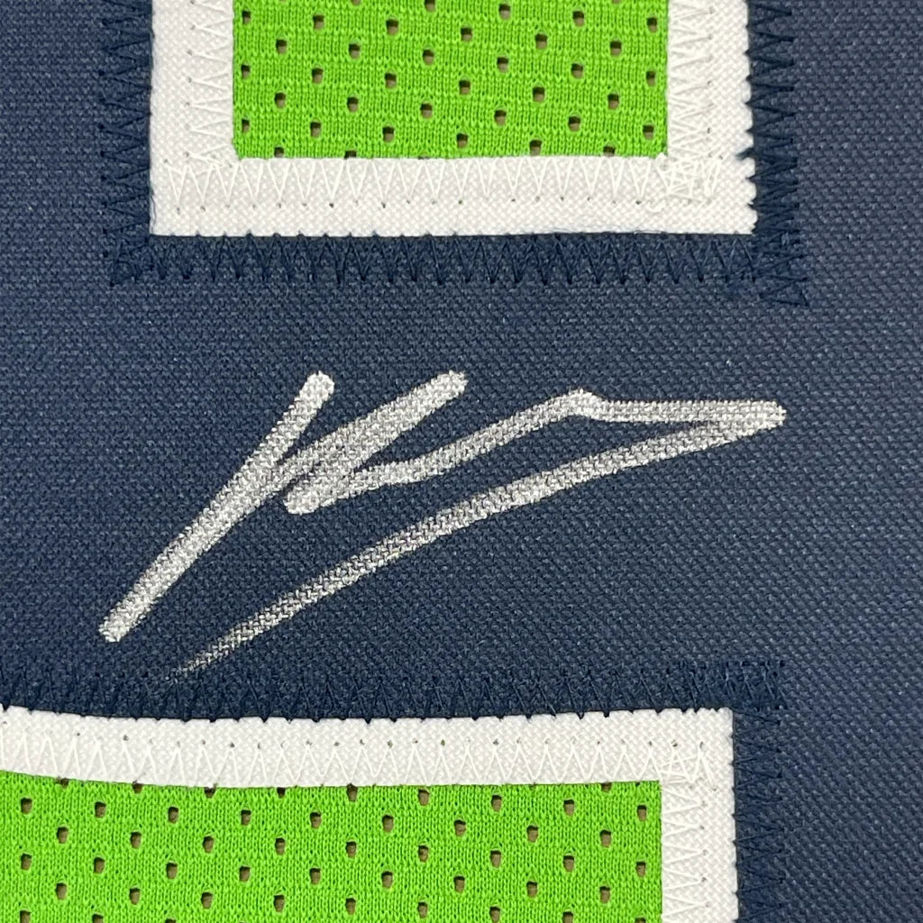 Navy blue WALKER III autographed sports jersey with lime green number and white signature