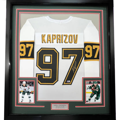Framed autographed white hockey jersey with gold and black accents from Game Worn collection