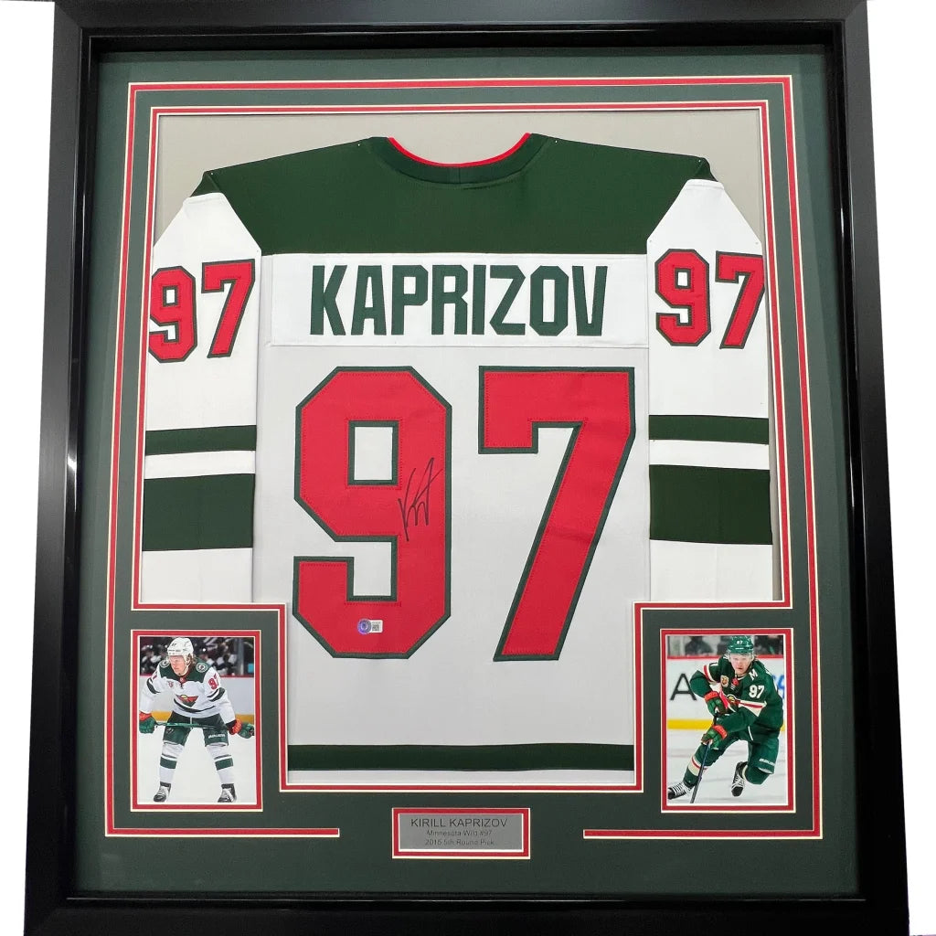 Autographed Minnesota Wild hockey jersey framed with player photos ready to display