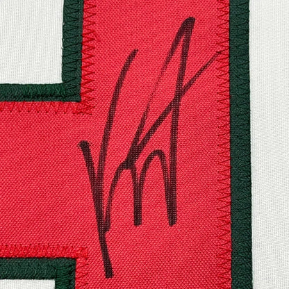 Red fabric patch with black embroidered signature on Autographed Minnesota Wild Jersey
