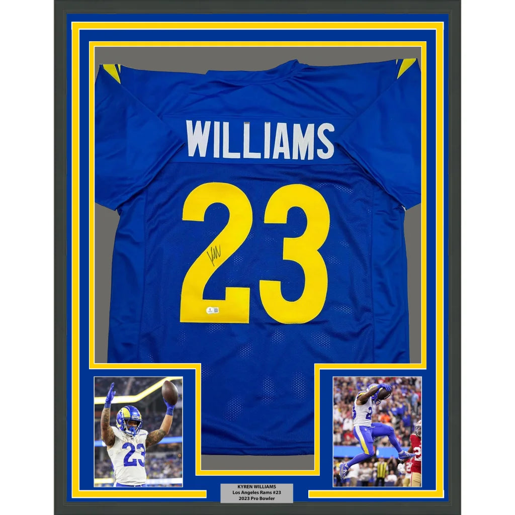 Autographed blue and yellow sports jersey with player photos in a frame for display