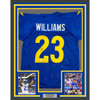 Autographed blue and yellow sports jersey with player photos in a frame for display