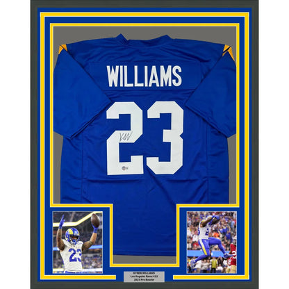 Autographed Blue Football Jersey with Player Photos in Frame Ready to Display