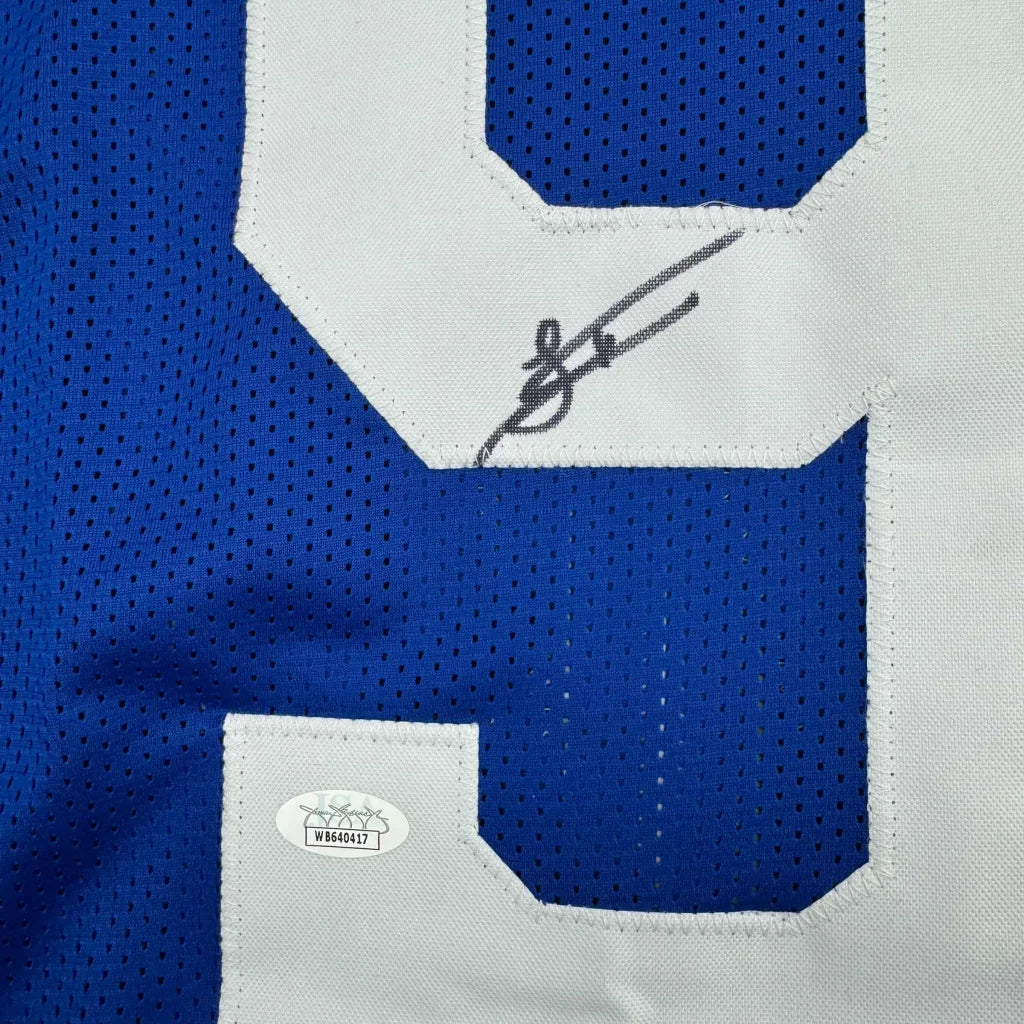 Blue Indianapolis Colts Latu jersey with white numbers and autograph ready to hang