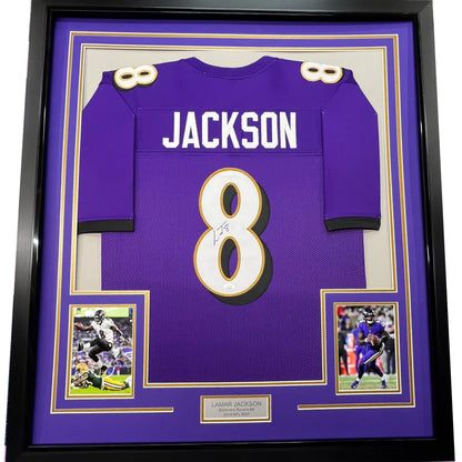 Framed autographed Lamar Jackson Baltimore Ravens purple jersey with number 8
