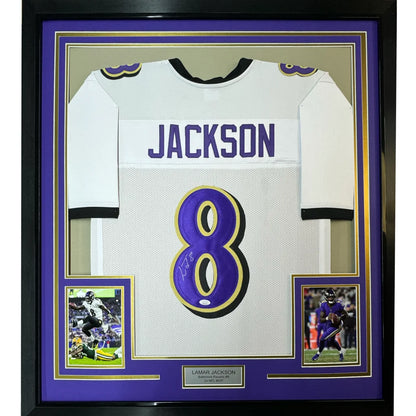 Framed autographed Lamar Jackson white Baltimore Ravens jersey with JSA COA