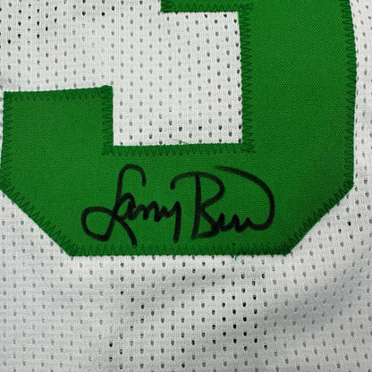 White mesh Larry Bird jersey with green 3 and black autograph in a professionally framed display