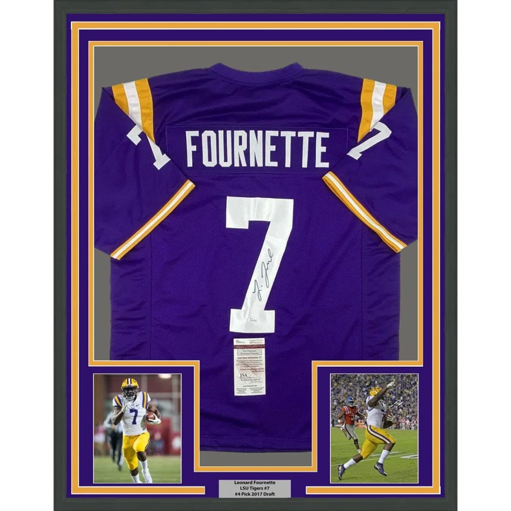 Framed autographed lsu purple football jersey with white number 7 gold sleeve stripes and leonard fournette signature